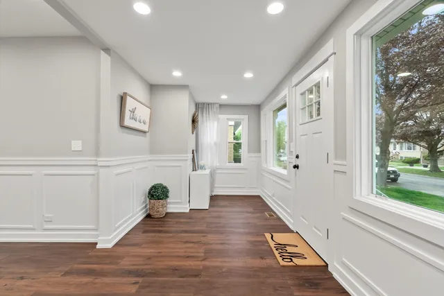 a view of livingroom with furniture wooden floor and windows