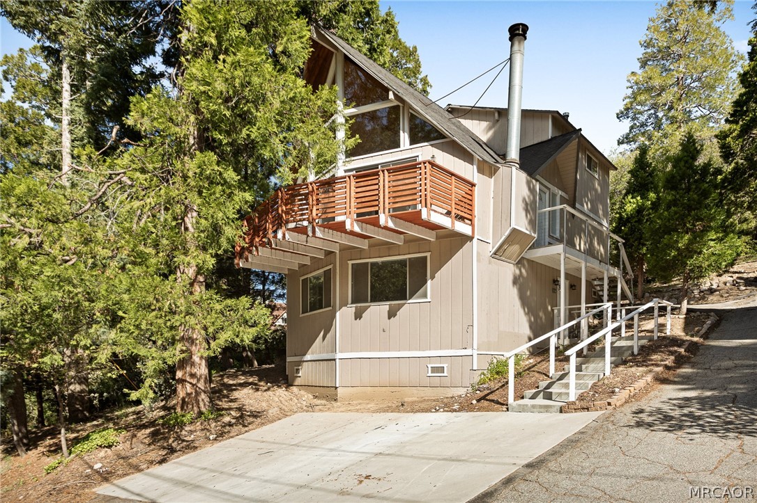 316 Pioneer Road Lake Arrowhead, CA 92352 - Photo 30 of 35 a view of a house with a tree