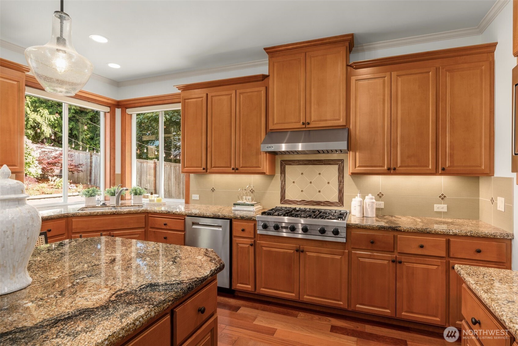 2022 240th Place Southeast Bothell, WA 98021 - Photo 17 of 40 a kitchen with stainless steel appliances granite countertop wooden cabinets a stove and a sink