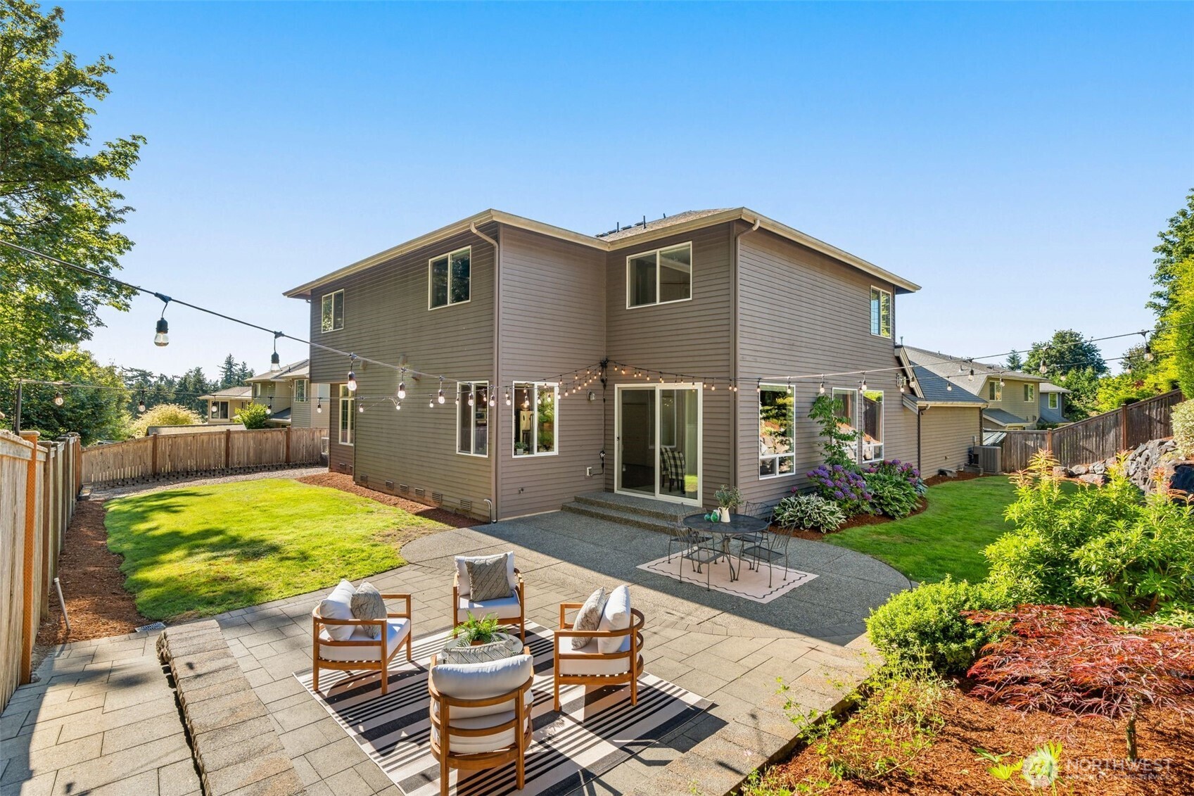 2022 240th Place Southeast Bothell, WA 98021 - Photo 34 of 40 a view of a house with backyard and sitting area