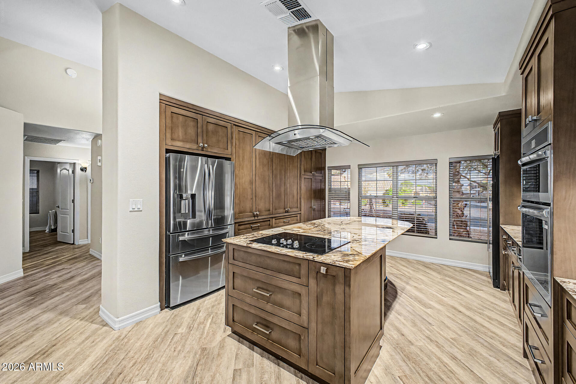 4102 East Rock Wren Road Phoenix, AZ 85044 - Photo 10 of 25 a kitchen with stainless steel appliances granite countertop a stove and a refrigerator