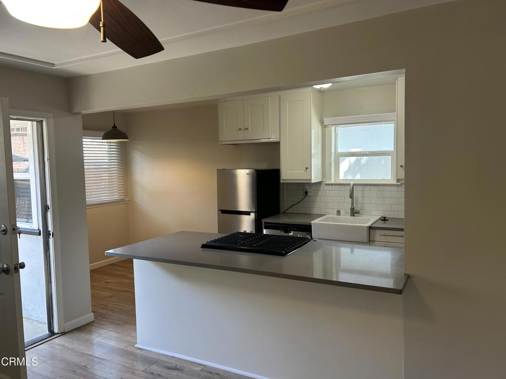 2661 Los Robles Road, Unit 2663 Thousand Oaks, CA 91362 - Photo 1 of 1 a living room with furniture and a fireplace