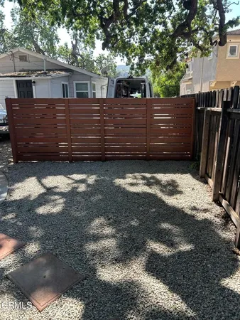 a view of a house with a back yard