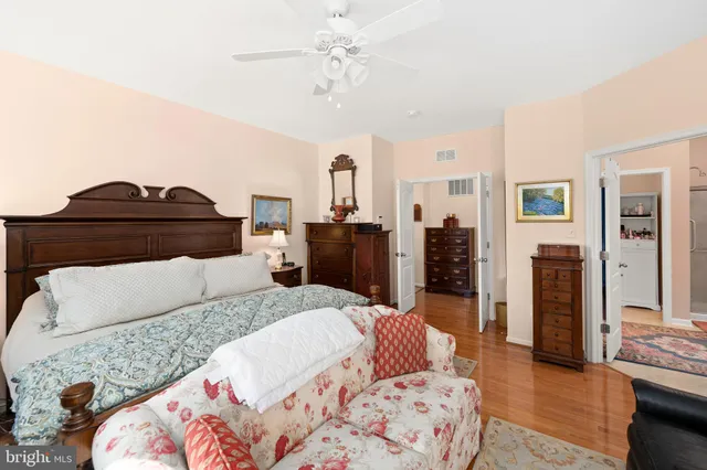 a bedroom with a large bed and a couch