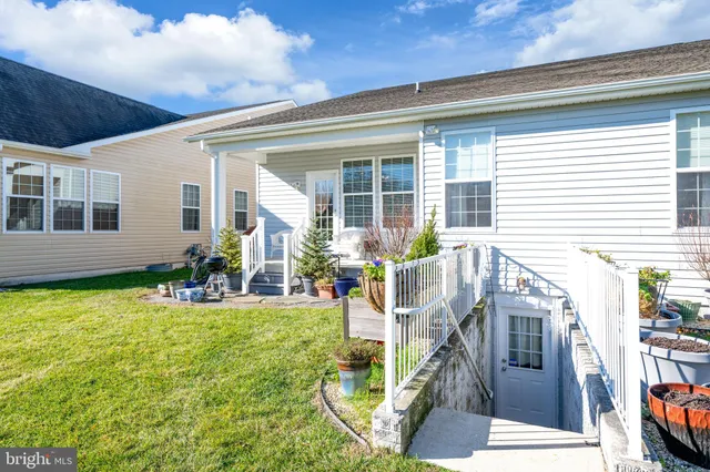 a view of a house with backyard porch and sitting area