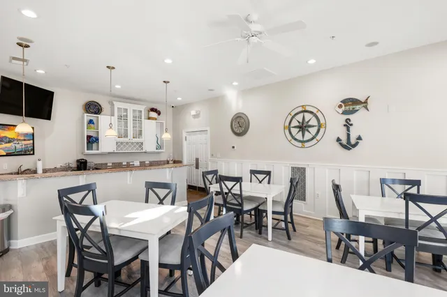 a view of a dining area with furniture and a flat screen tv