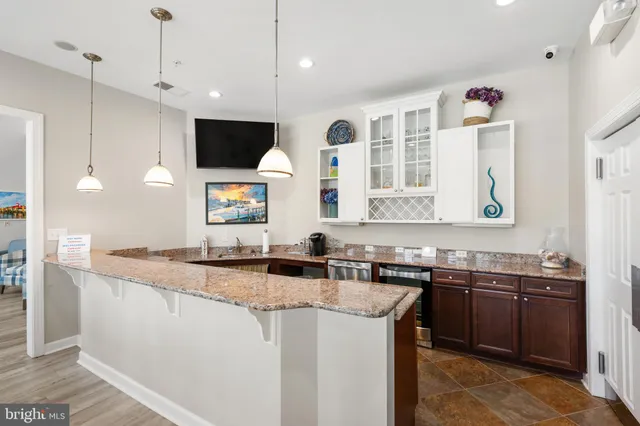 a kitchen with a sink stove and microwave