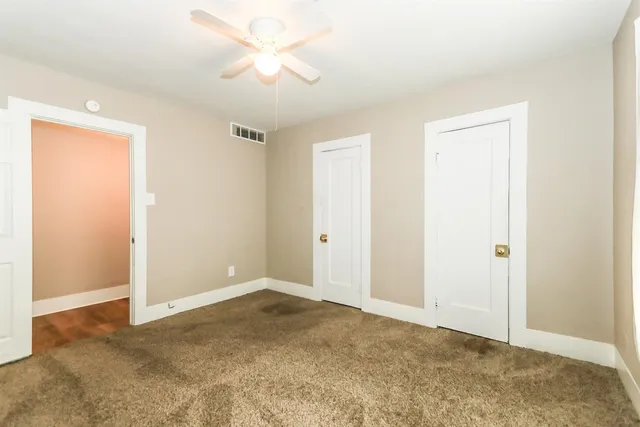 a view of room with ceiling fan