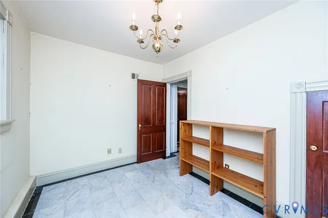 a view of an empty room with a cabinet