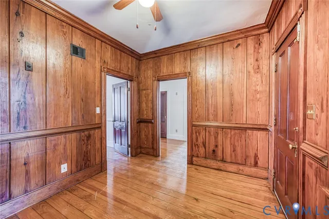 a view of a hallway with wooden floors