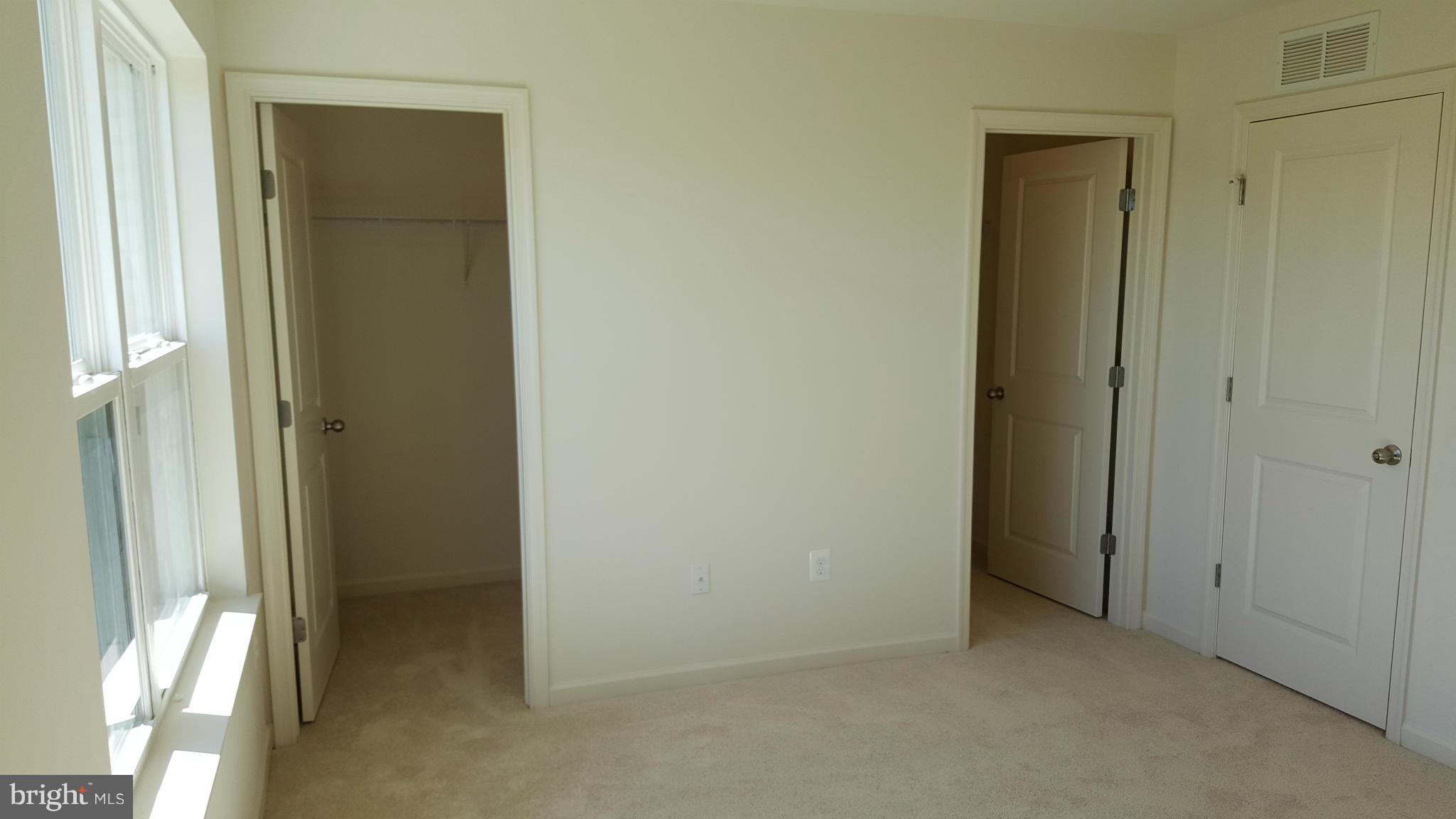 2043 Spring Run Circle Frederick, MD 21702 - Photo 13 of 18 Master Bedroom walk-in closets