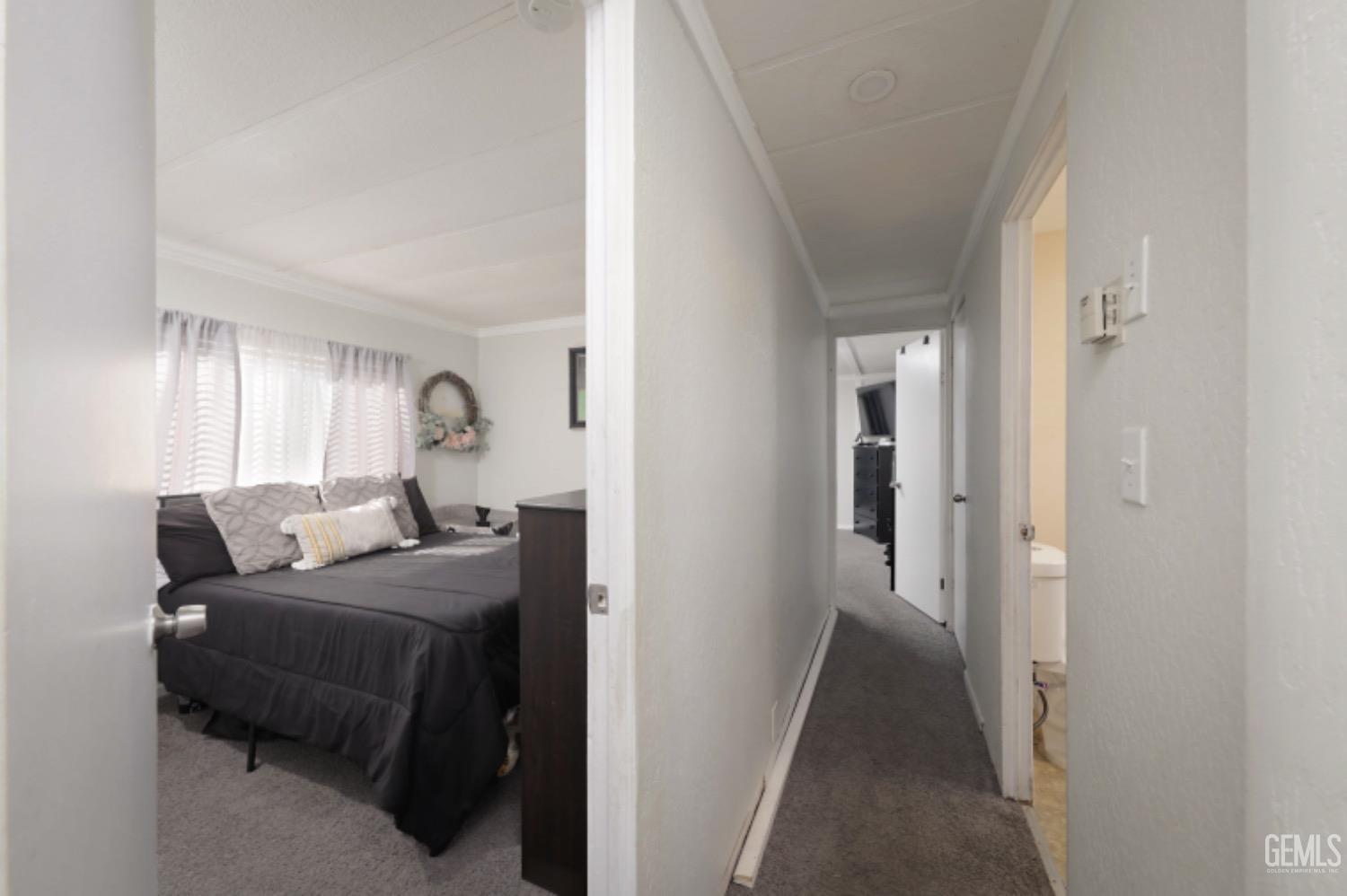 Undisclosed Address Bakersfield, CA 93306 - Photo 11 of 35 a bedroom with a bed and a mirror