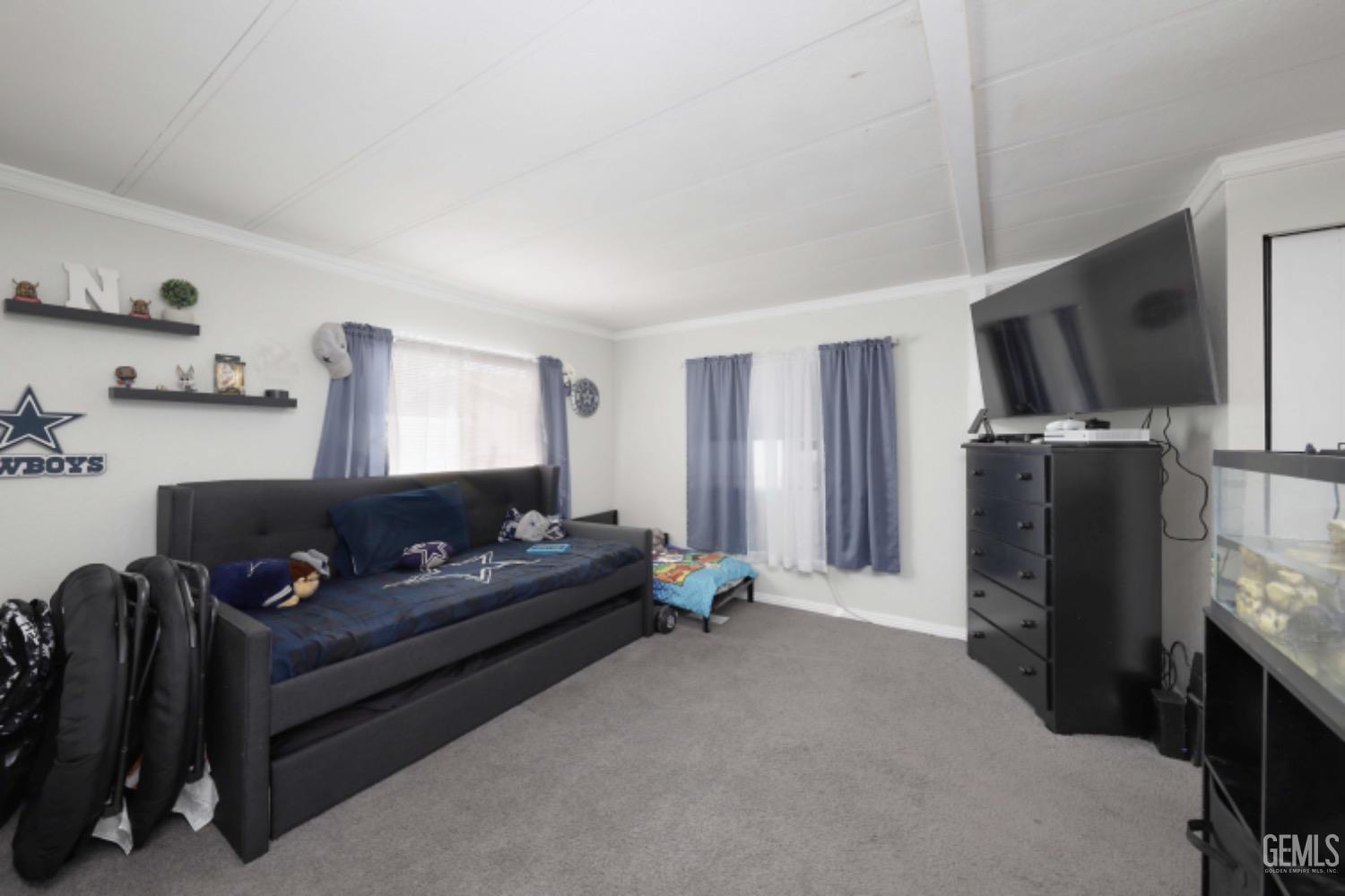 Undisclosed Address Bakersfield, CA 93306 - Photo 14 of 35 a living room with furniture and a flat screen tv