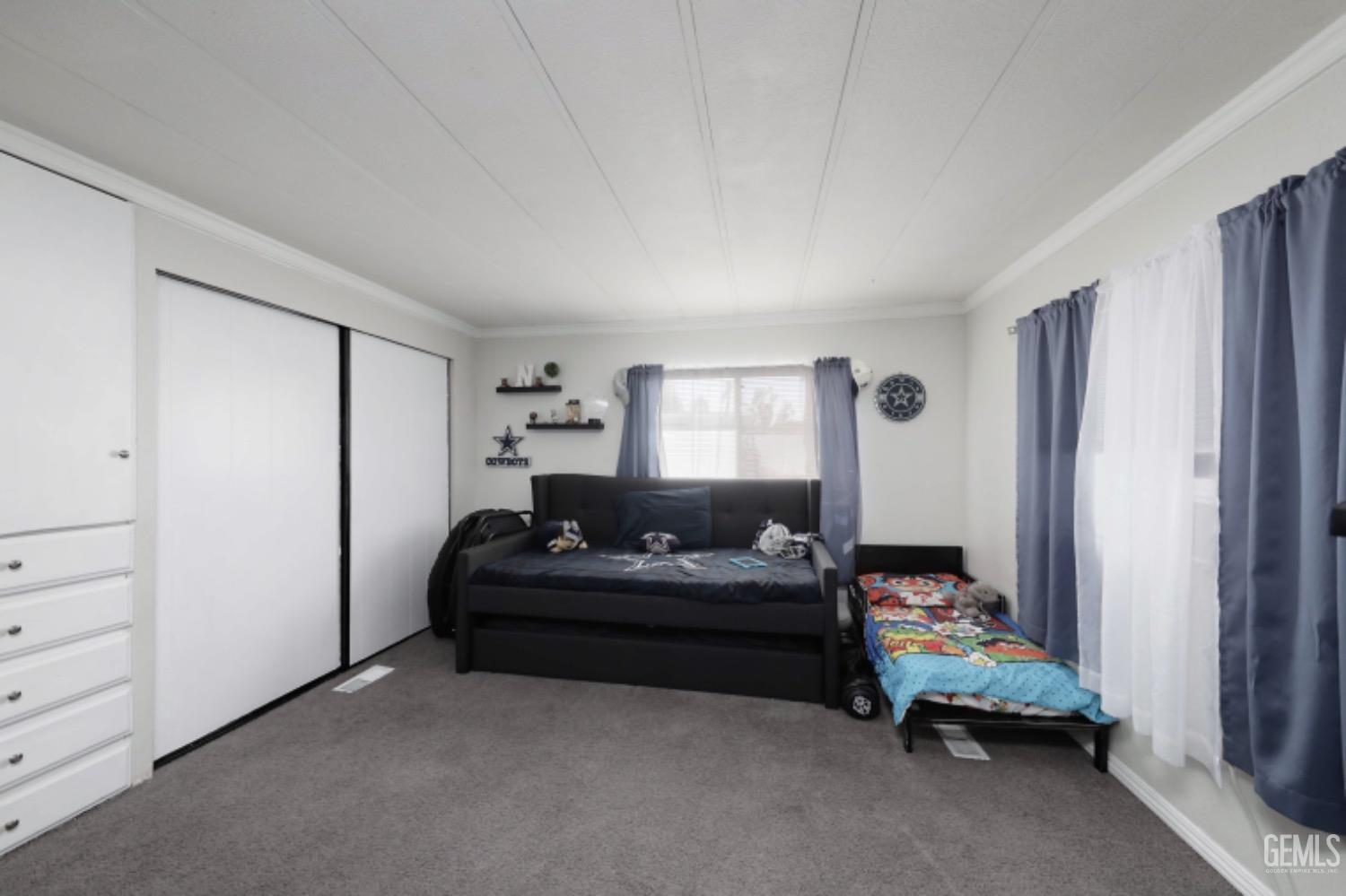 Undisclosed Address Bakersfield, CA 93306 - Photo 17 of 35 a bedroom with bed and window