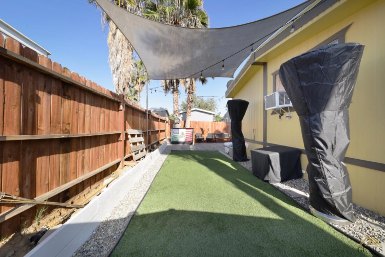 Undisclosed Address Bakersfield, CA 93306 - Photo 31 of 35 a view of a backyard with chairs