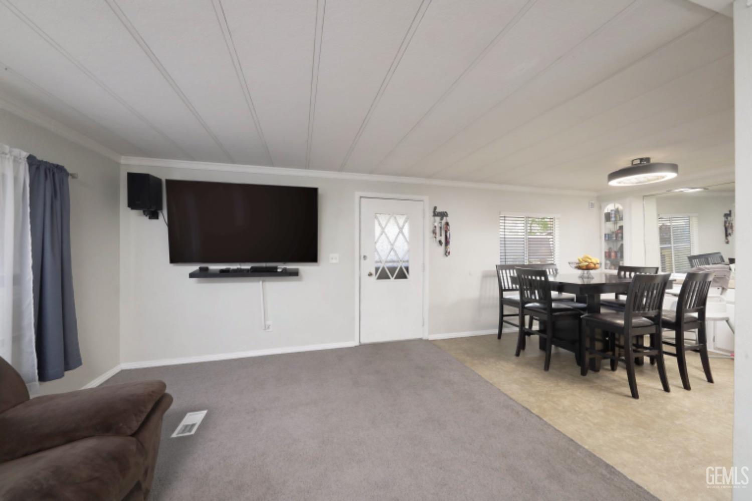 Undisclosed Address Bakersfield, CA 93306 - Photo 4 of 35 a view of a livingroom with furniture and a flat screen tv