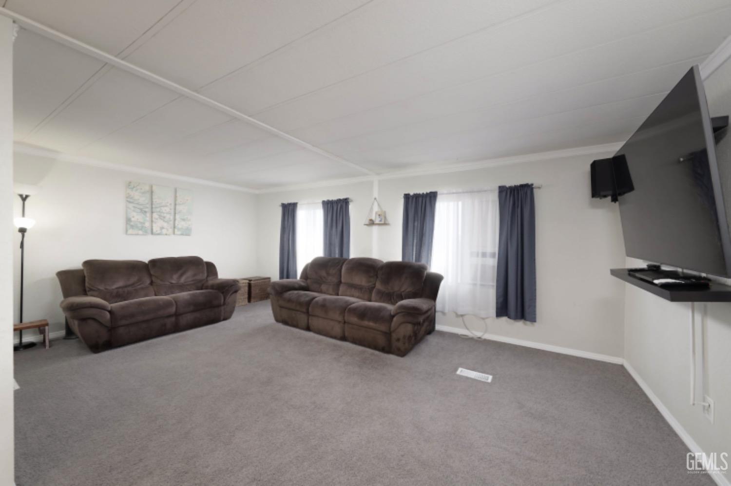 Undisclosed Address Bakersfield, CA 93306 - Photo 5 of 35 a living room with furniture and a flat screen tv