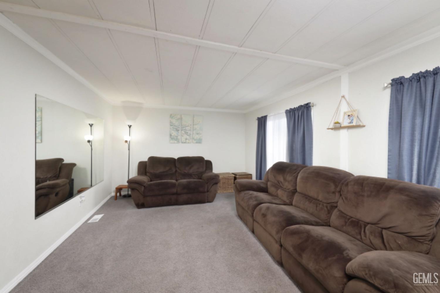 Undisclosed Address Bakersfield, CA 93306 - Photo 6 of 35 a living room with furniture and a couch