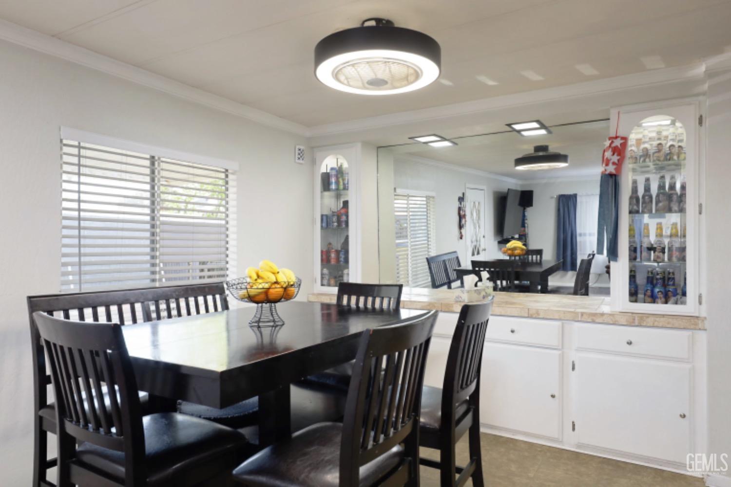 Undisclosed Address Bakersfield, CA 93306 - Photo 9 of 35 a view of a dining room with furniture and chandelier