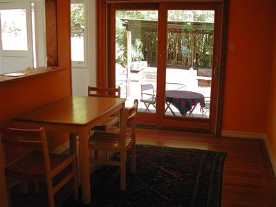 98 Bothin Road Fairfax, CA 94930 - Photo 3 of 6 a living room with a table chairs and a fireplace