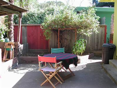 98 Bothin Road Fairfax, CA 94930 - Photo 6 of 6 a patio with table and chairs and potted plants