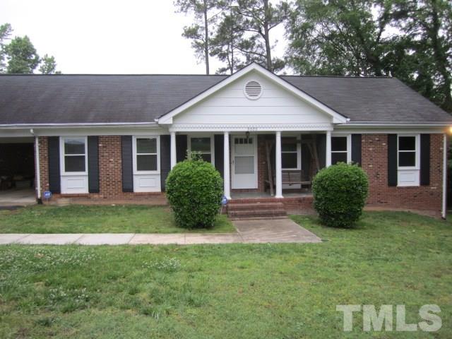 9505 Fonville Road Raleigh, NC 27614 - Photo 1 of 7 a view of a house with a yard plants and large tree