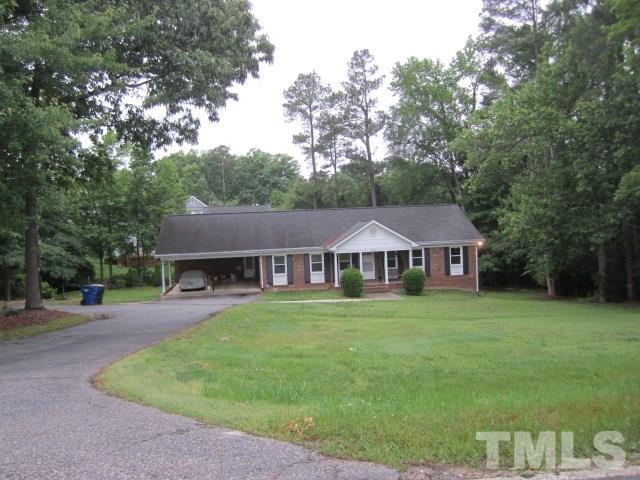 9505 Fonville Road Raleigh, NC 27614 - Photo 3 of 7 a front view of a house with a garden