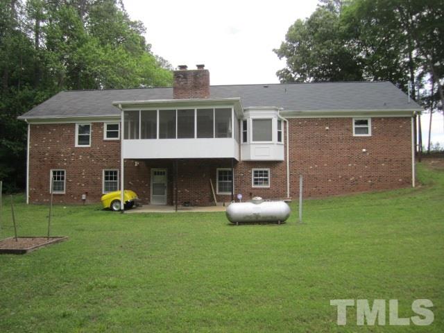 9505 Fonville Road Raleigh, NC 27614 - Photo 4 of 7 a view of an house with backyard space and sitting area