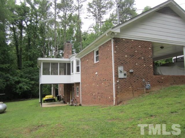 9505 Fonville Road Raleigh, NC 27614 - Photo 5 of 7 a front view of a house with garden