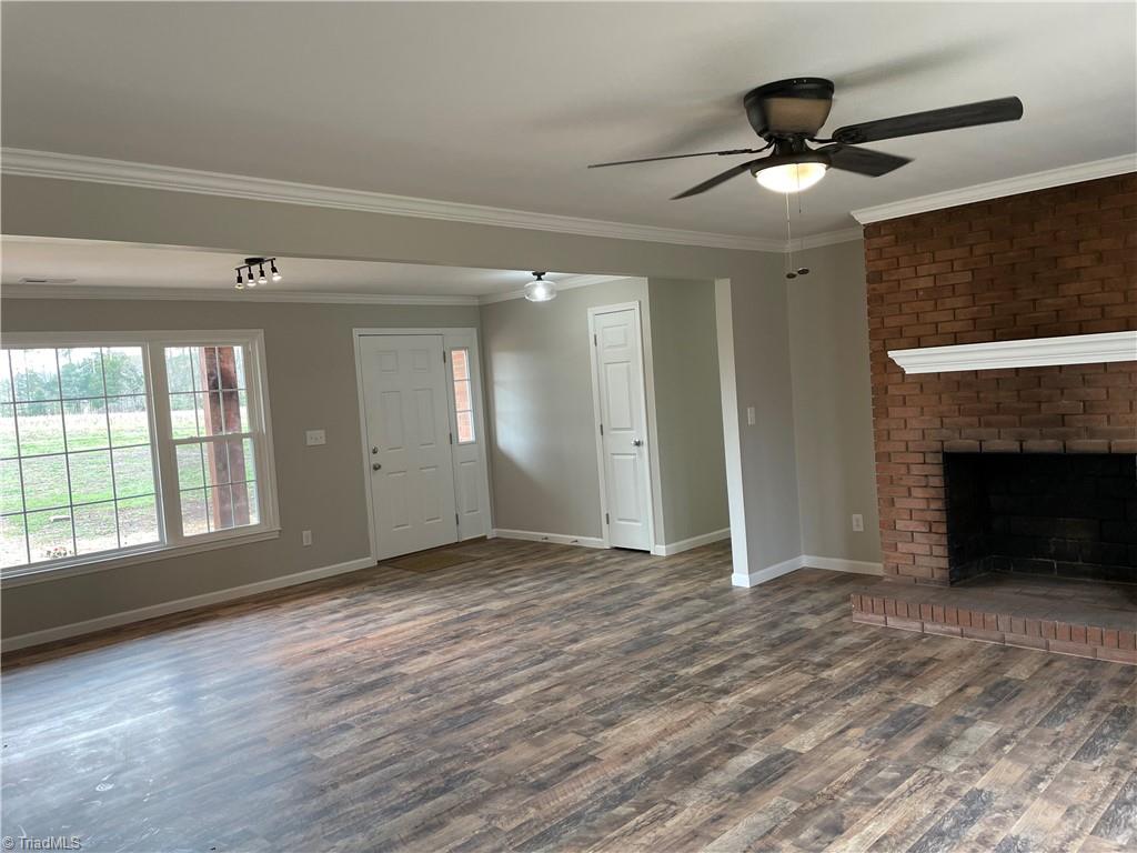 1709 Bloomtown Road East Bend, NC 27018 - Photo 9 of 30 Bright living room and den with fireplace
