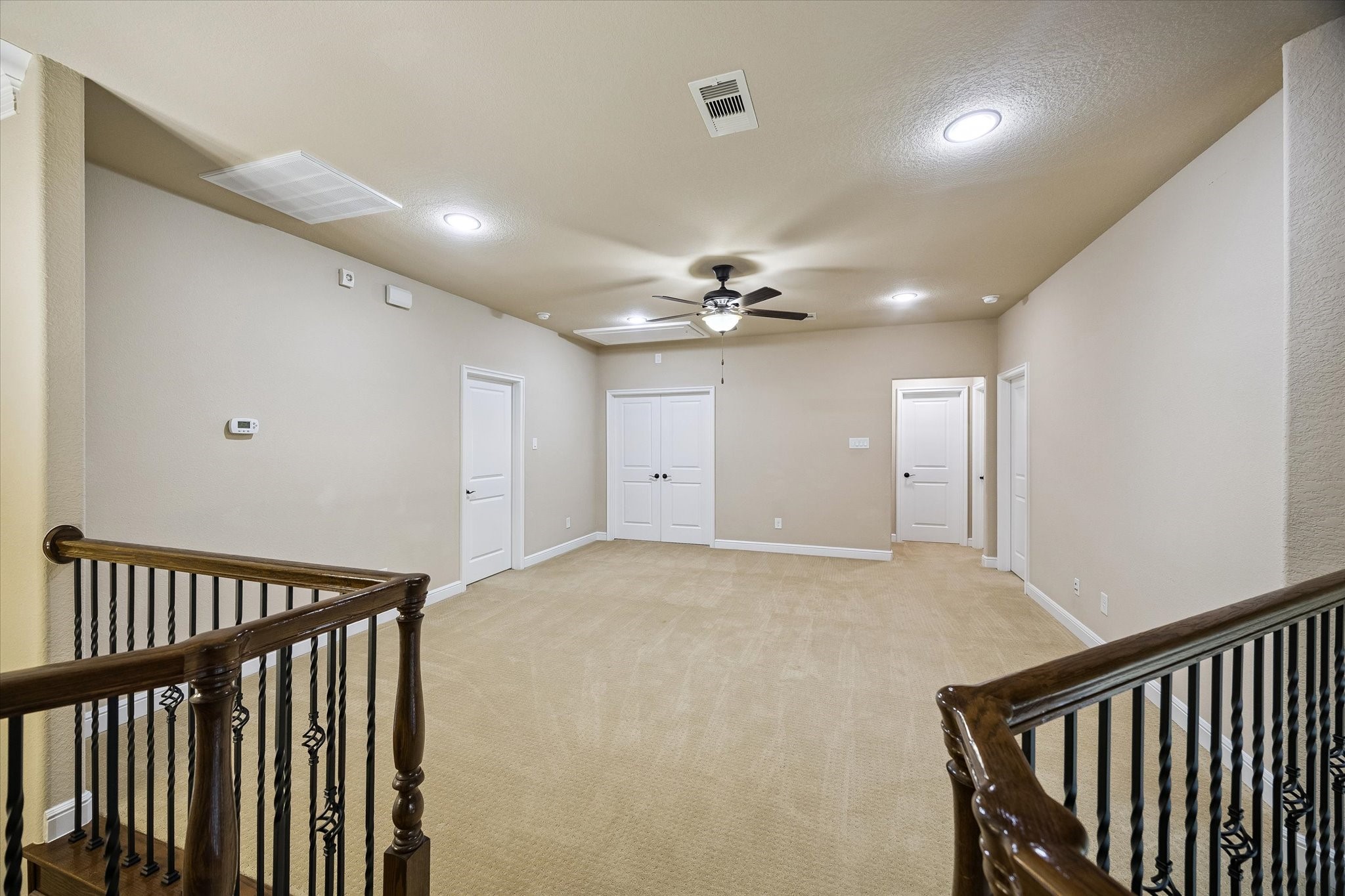 35 North Fremont Ridge Loop Spring, TX 77389 - Photo 20 of 37 Anchoring the second floor, the expansive game room provides a versatile space for recreation, relaxation, or family gatherings. Conveniently situated between the secondary bedrooms and media room, it offers the perfect setting for game nights, watching television, or creating a customized entertainment space.