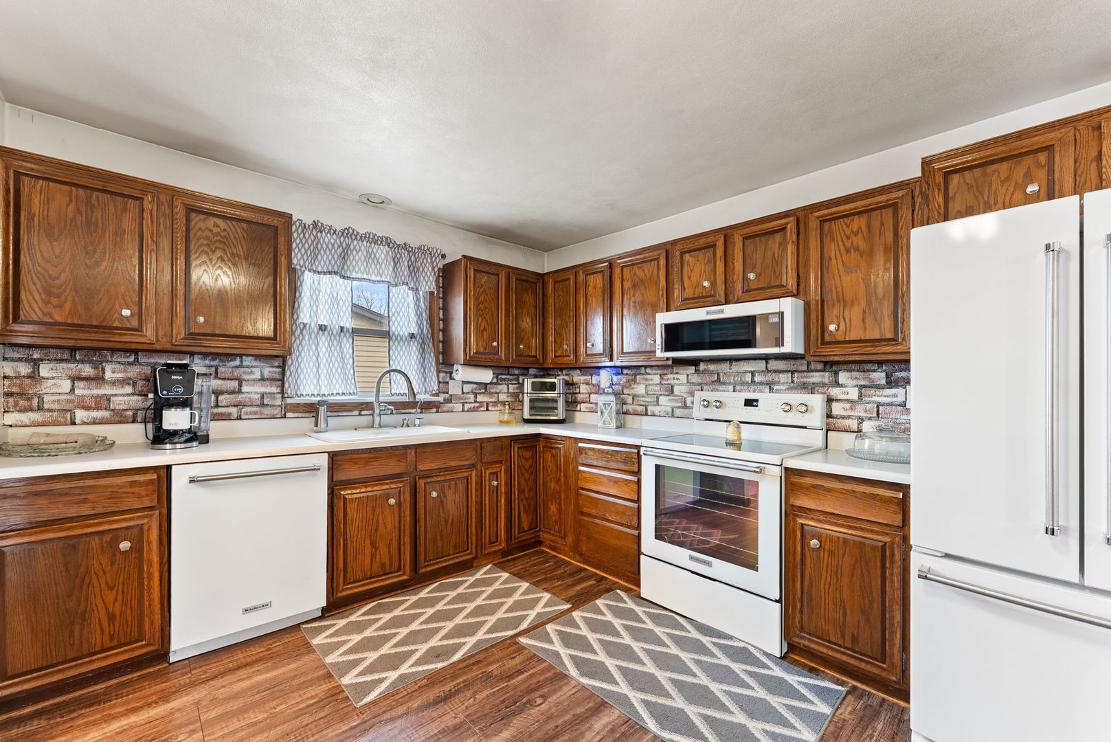 110 Andrea Court Cleveland, IL 61241 - Photo 11 of 23 a kitchen with stainless steel appliances granite countertop a refrigerator stove microwave and sink