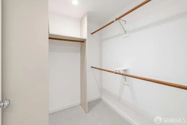 a view of staircase with white walls