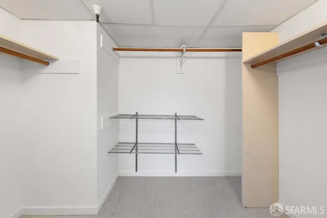 a view of an empty walk in closet