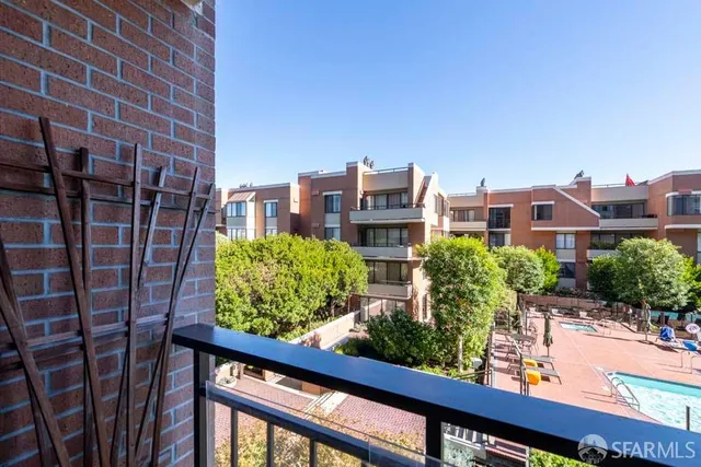 a view of a balcony with chairs