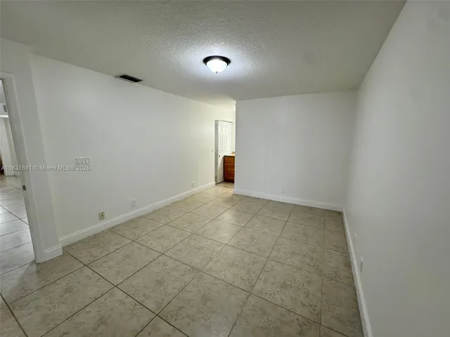 a white toilet sitting next to a shower
