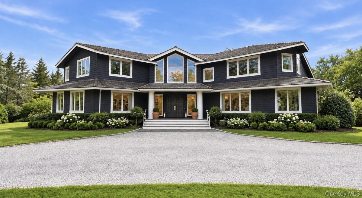 25 Ring Neck Road Remsenburg, NY 11960 - Photo 4 of 19 AI Front of Home and Landscaped Virtually