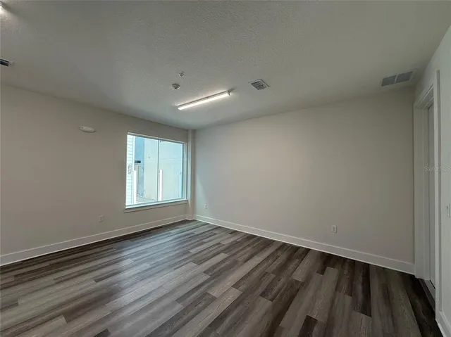 a view of wooden floor in an empty room