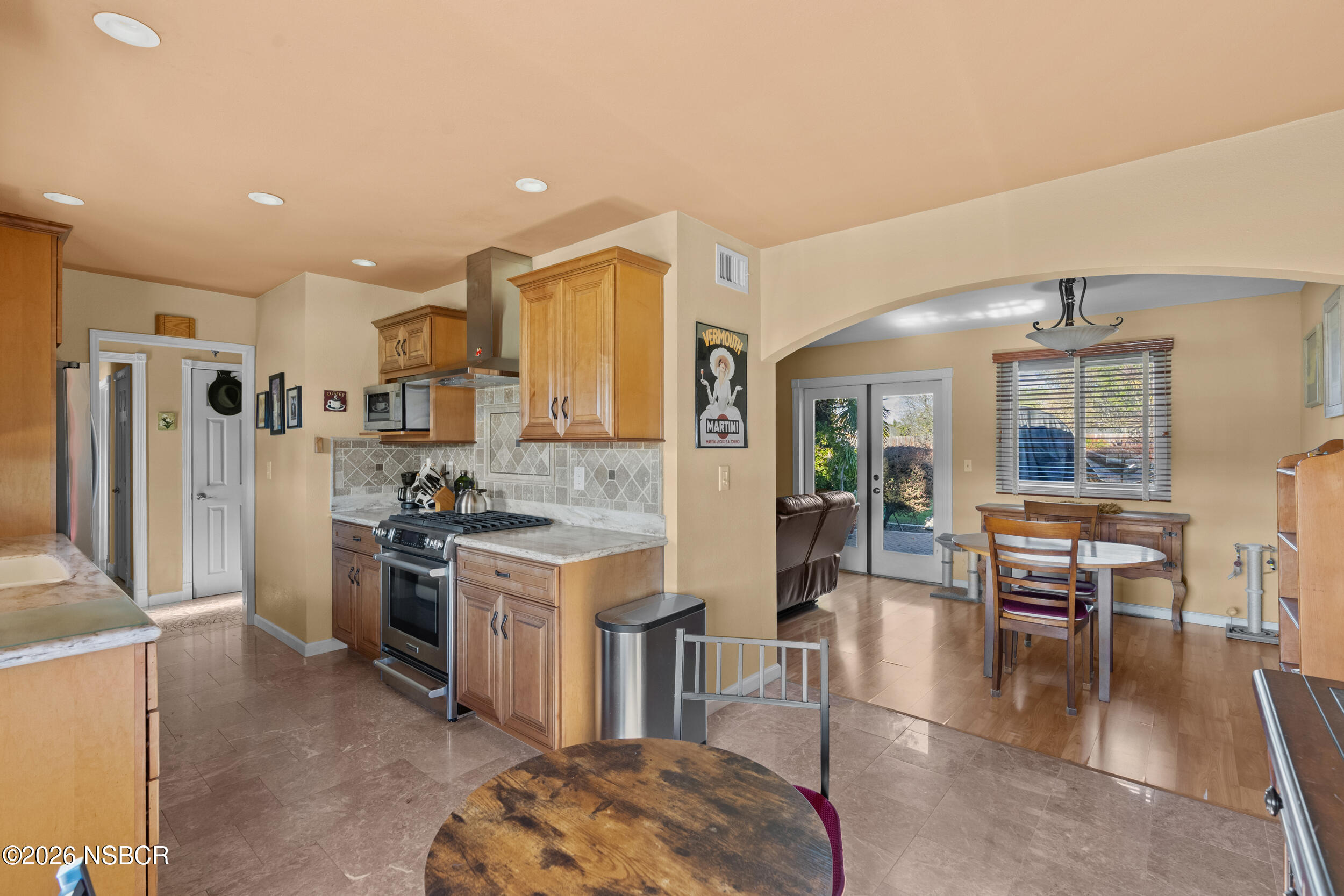 1157 Glines Avenue Santa Maria, CA 93455 - Photo 14 of 41 a kitchen with stainless steel appliances granite countertop a stove and a refrigerator