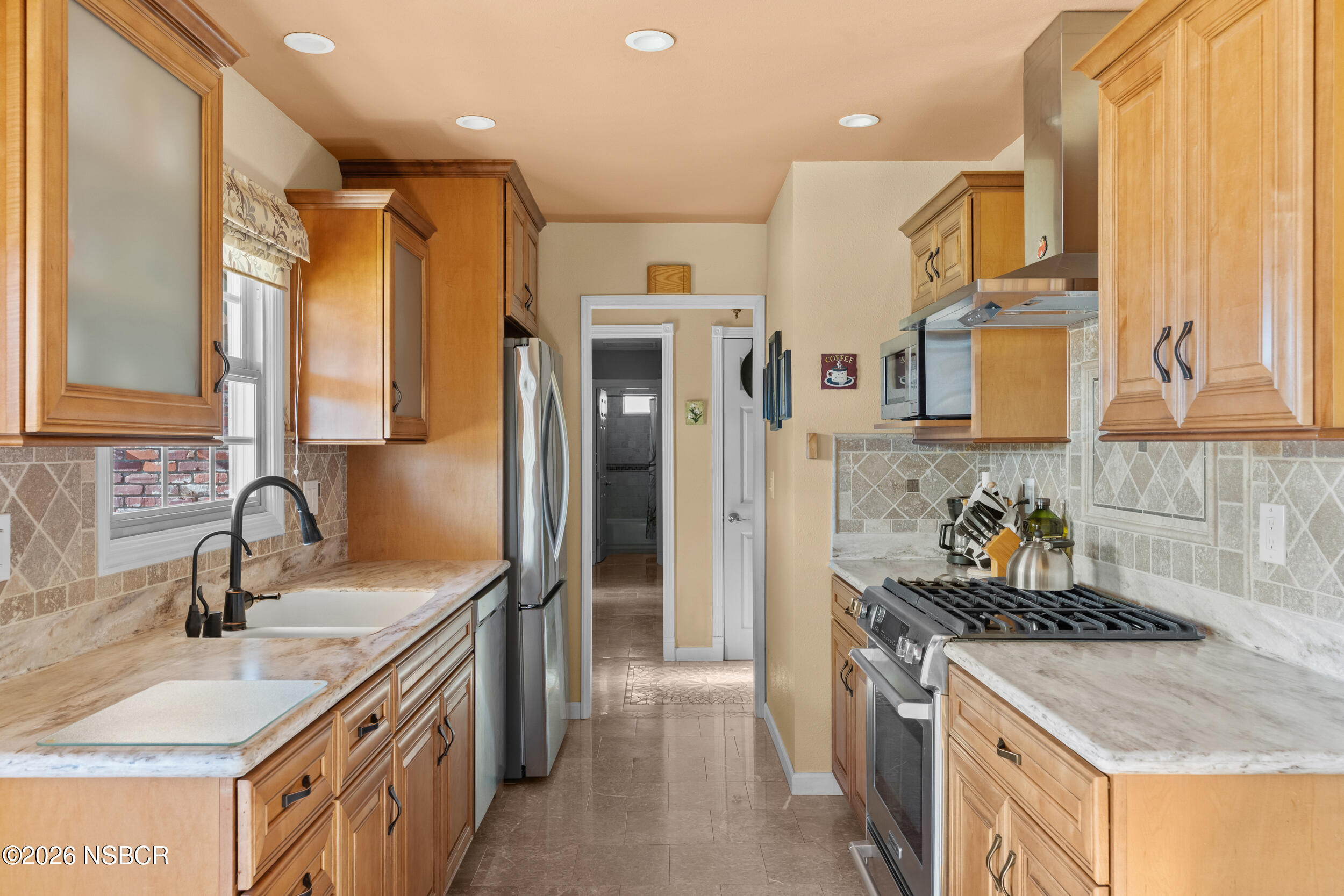 1157 Glines Avenue Santa Maria, CA 93455 - Photo 15 of 41 a kitchen with stainless steel appliances granite countertop a sink stove and refrigerator