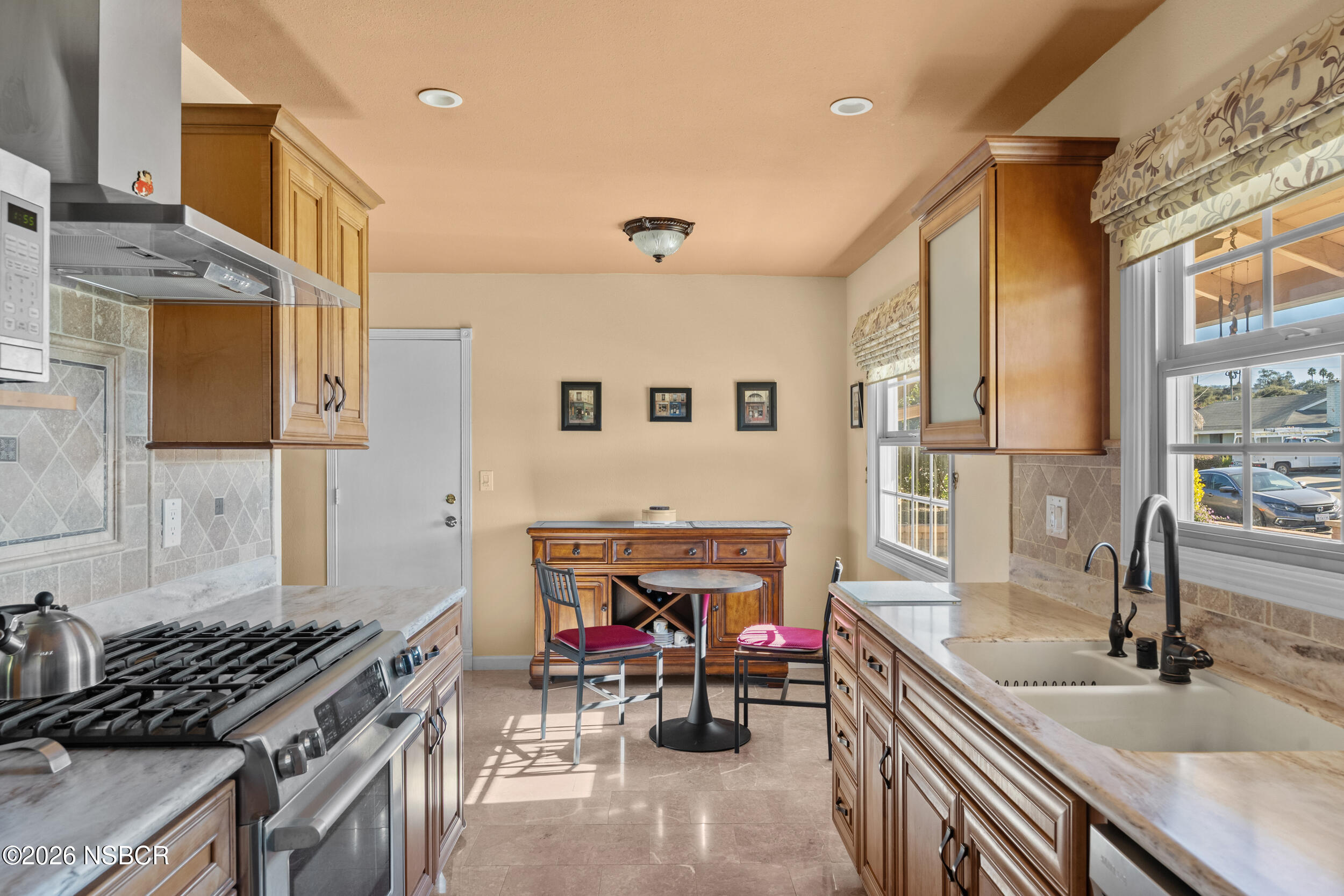 1157 Glines Avenue Santa Maria, CA 93455 - Photo 20 of 41 a kitchen with stainless steel appliances granite countertop a stove a sink and a refrigerator