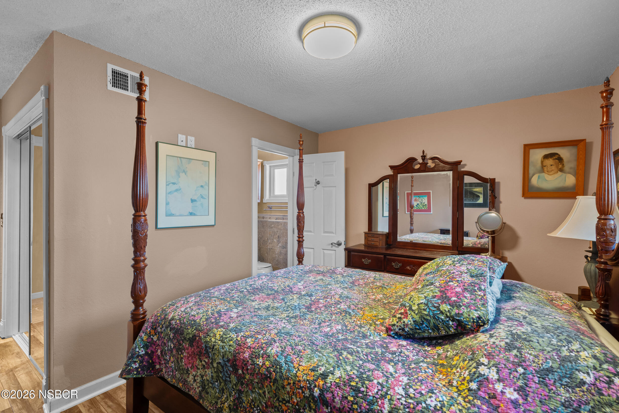 1157 Glines Avenue Santa Maria, CA 93455 - Photo 27 of 41 a bedroom with a bed dresser and mirror
