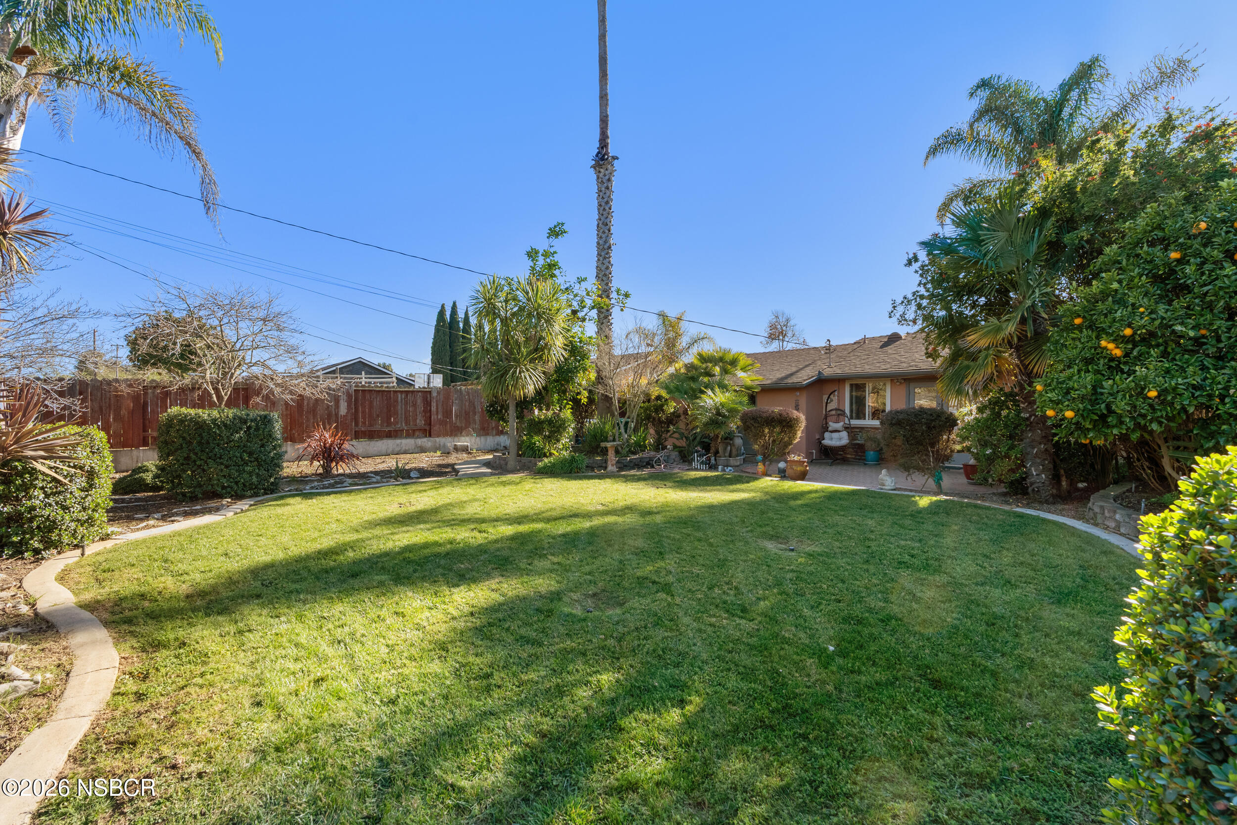 1157 Glines Avenue Santa Maria, CA 93455 - Photo 34 of 41 a view of a house with a yard and sitting area