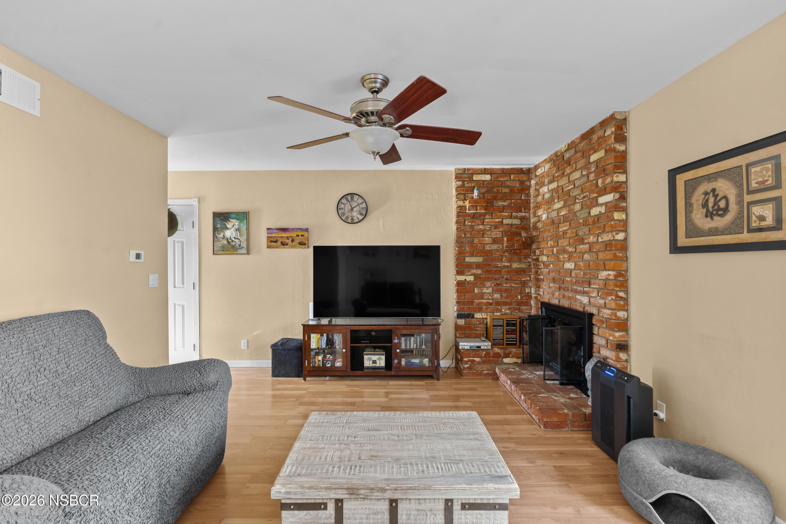 1157 Glines Avenue Santa Maria, CA 93455 - Photo 7 of 41 a living room with furniture and a flat screen tv