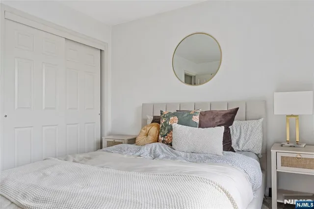 a bathroom with a sink toilet and a mirror