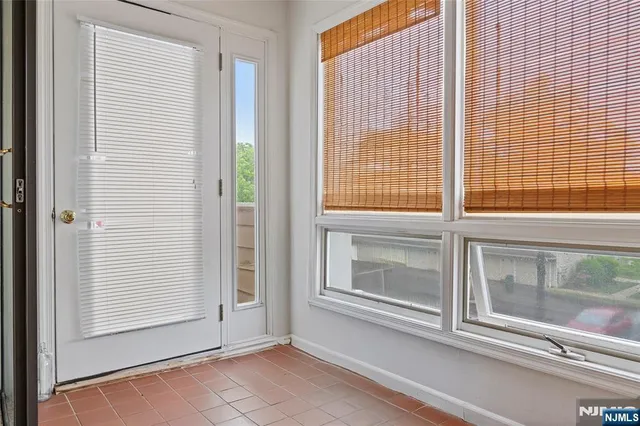 an aerial view of a house with outdoor space and a garden