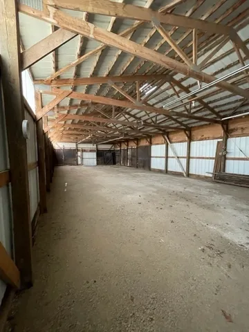 a view of a room with wooden walls