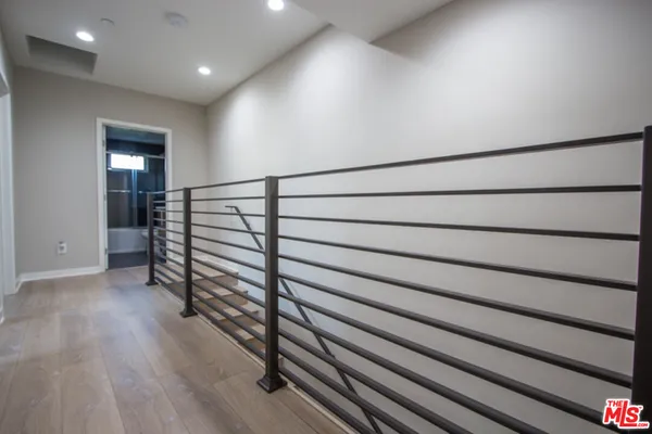 a view of entryway with wooden floor