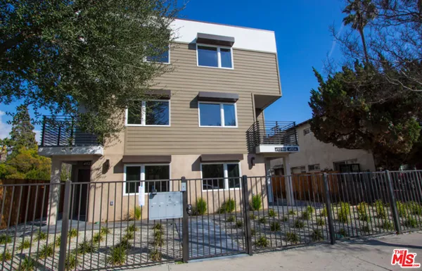 a front view of house with street view