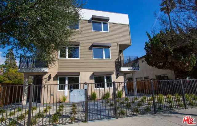 a front view of house with street view